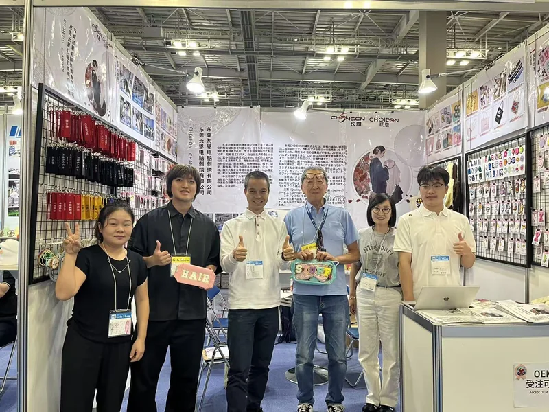 Changen Industries booth at the Tokyo Gift Show with the product wall and team