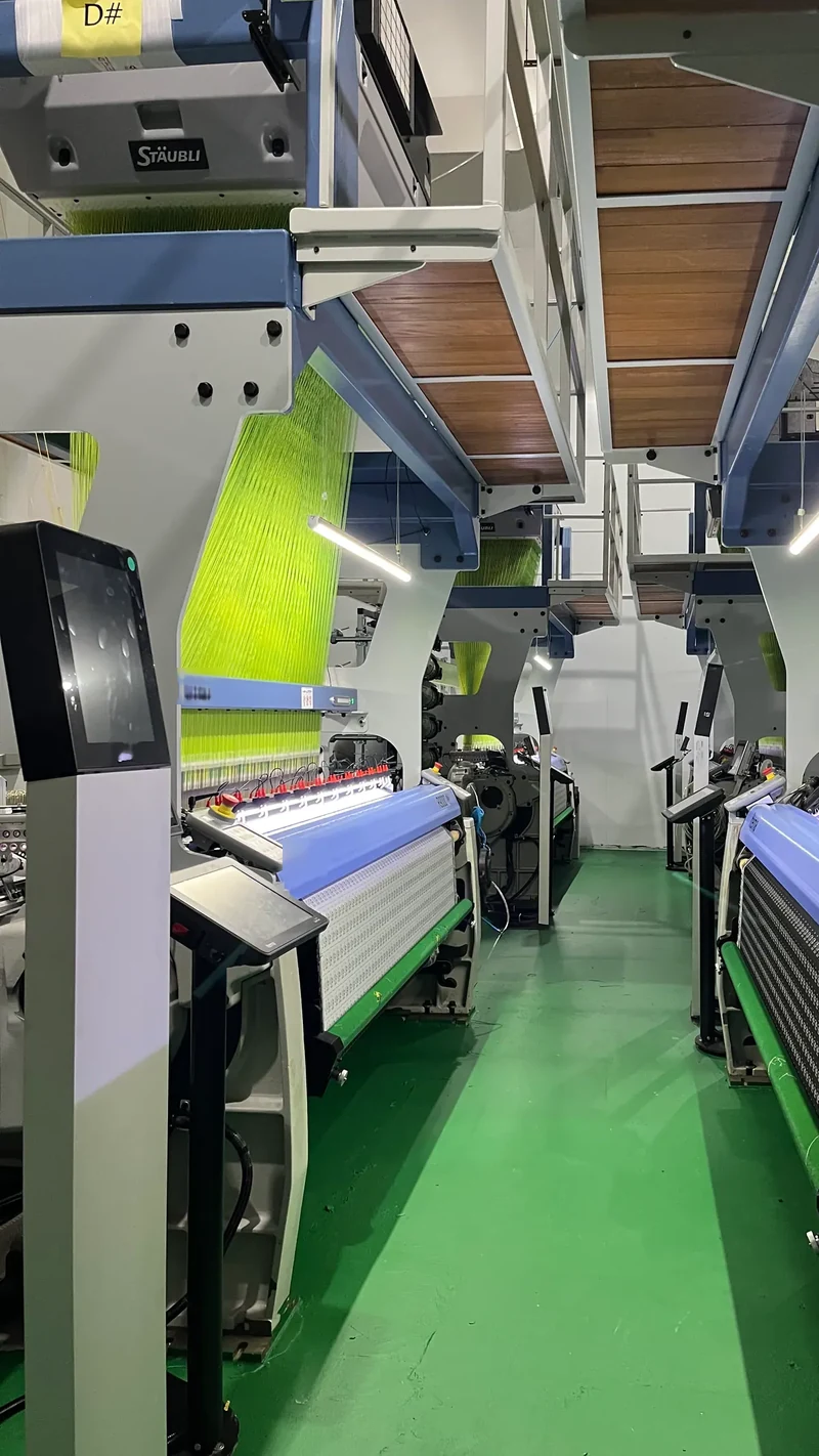 Woven label machines in the PatchKey Works weaving room