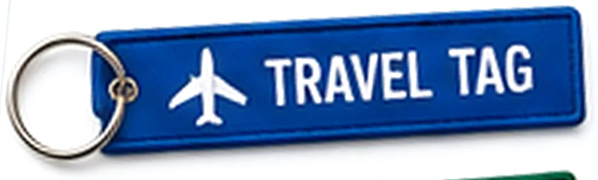 Blue woven key tag printed with a plane and the words Travel Tag
