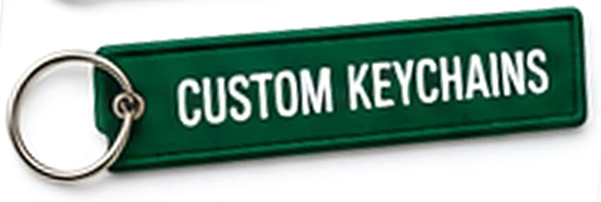 Green woven key tag printed with the words Custom Keychains