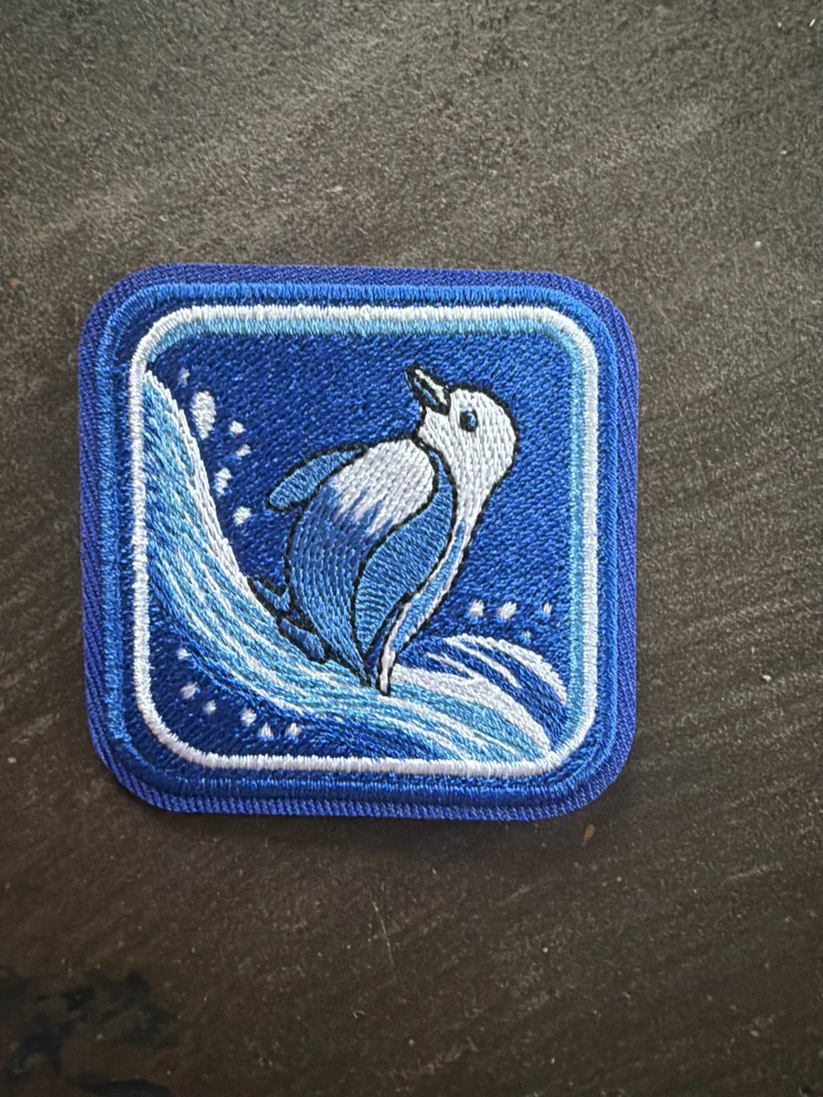 Precision 100% embroidered blue penguin patch with tight 3mm merrowed border