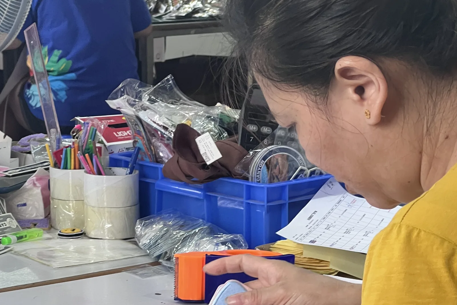 Keychains checked by hand at the PatchKey Works packing bench