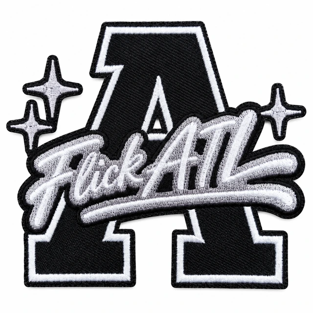 Black-and-white embroidered patch from an apparel brand project; background edited with AI